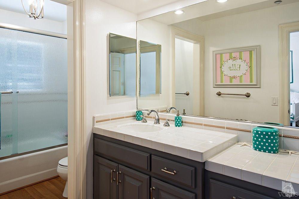1784 Upper Ranch Road Westlake Village, CA 91362 - Photo 38 of 53 a bathroom with a sink and a mirror