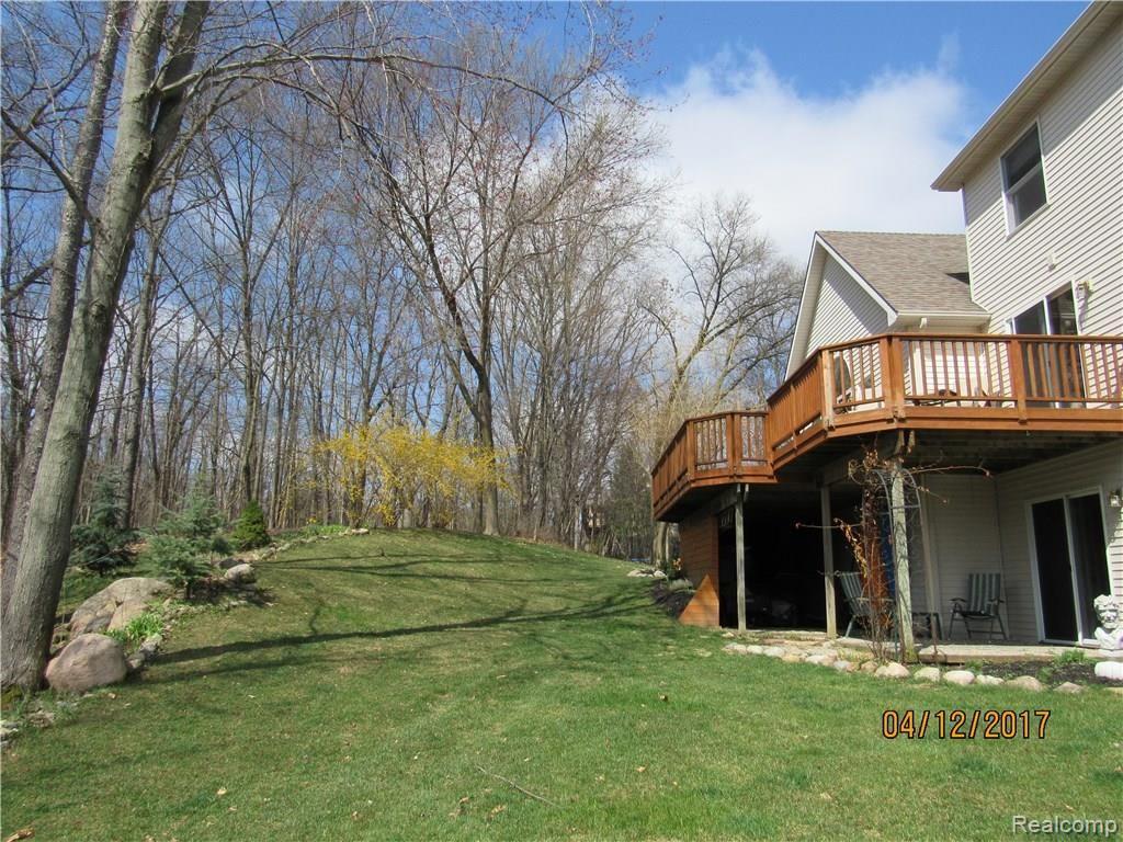 1212 Elk Run Howell, MI 48843 - Photo 5 of 32 Wooded backyard.