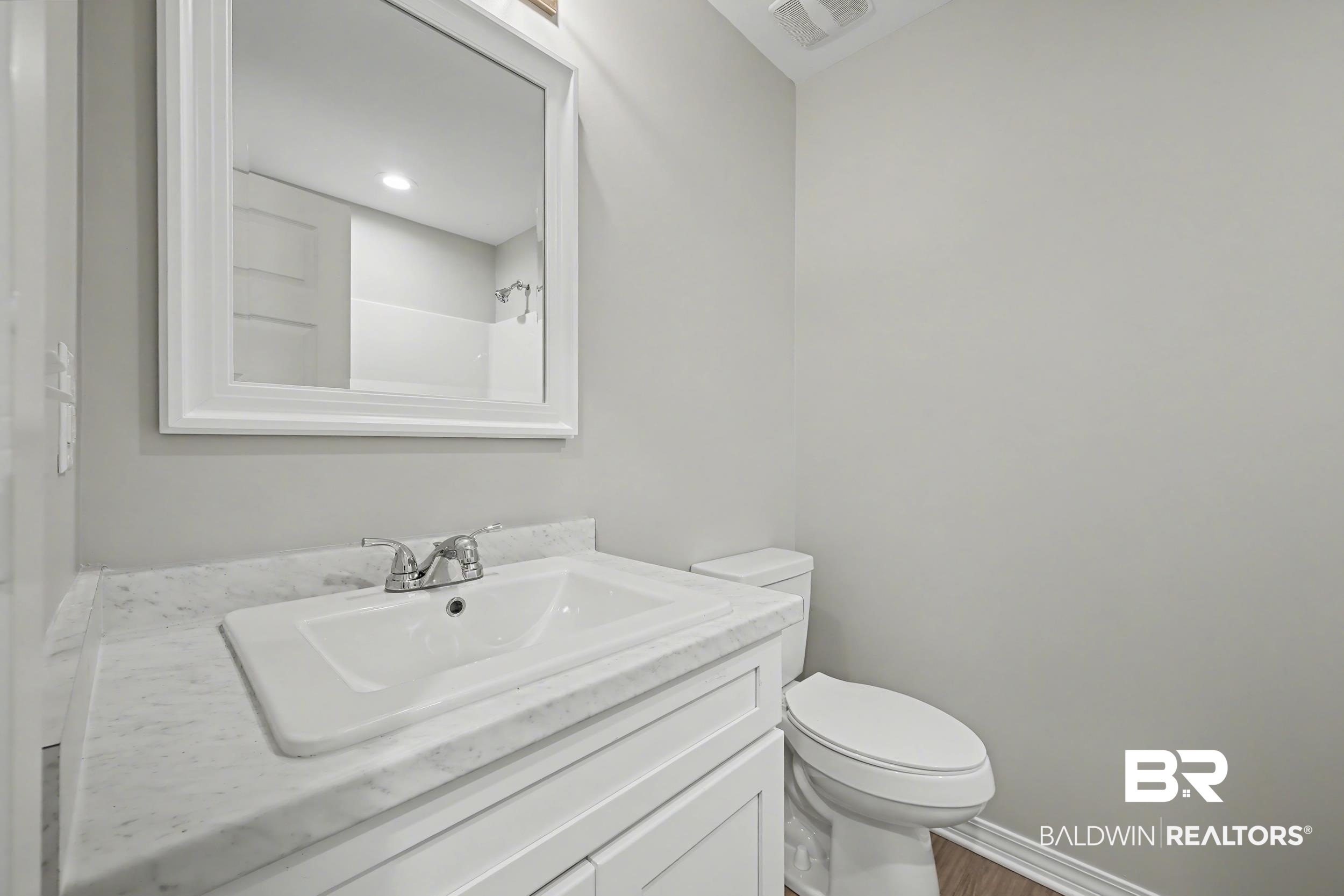 76 Fincher Lane Loxley, AL 36551 - Photo 26 of 33 Full bath with vanity, a shower, and wood finished floors