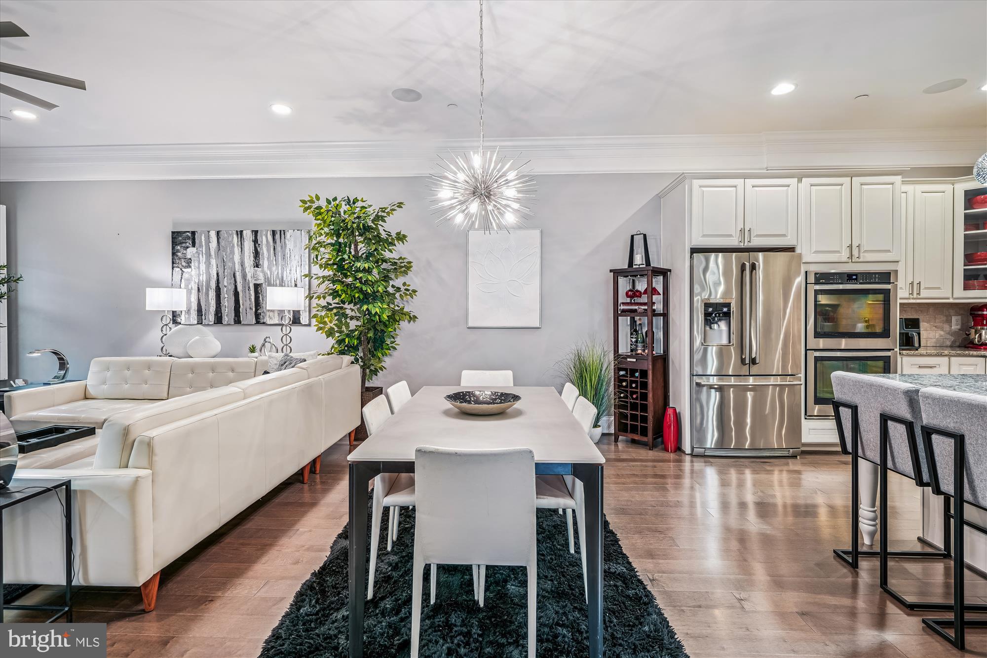 1222 Beaver Tree Drive Odenton, MD 21113 - Photo 5 of 24 a dining room with furniture a kitchen and chandelier