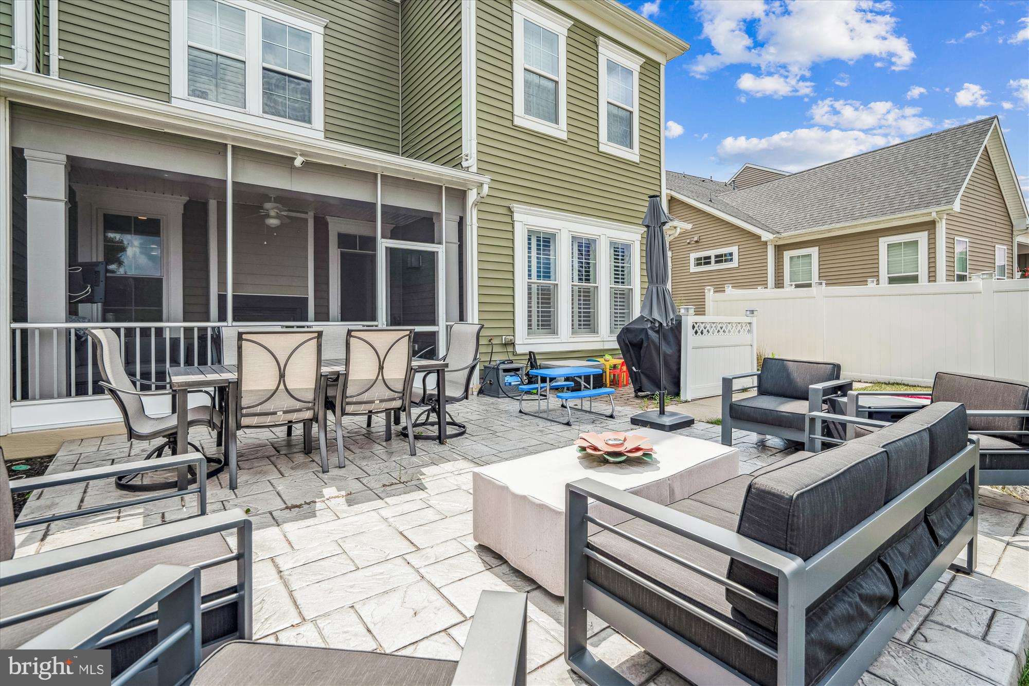 1222 Beaver Tree Drive Odenton, MD 21113 - Photo 10 of 24 a view of a patio with couches table and chairs and potted plants