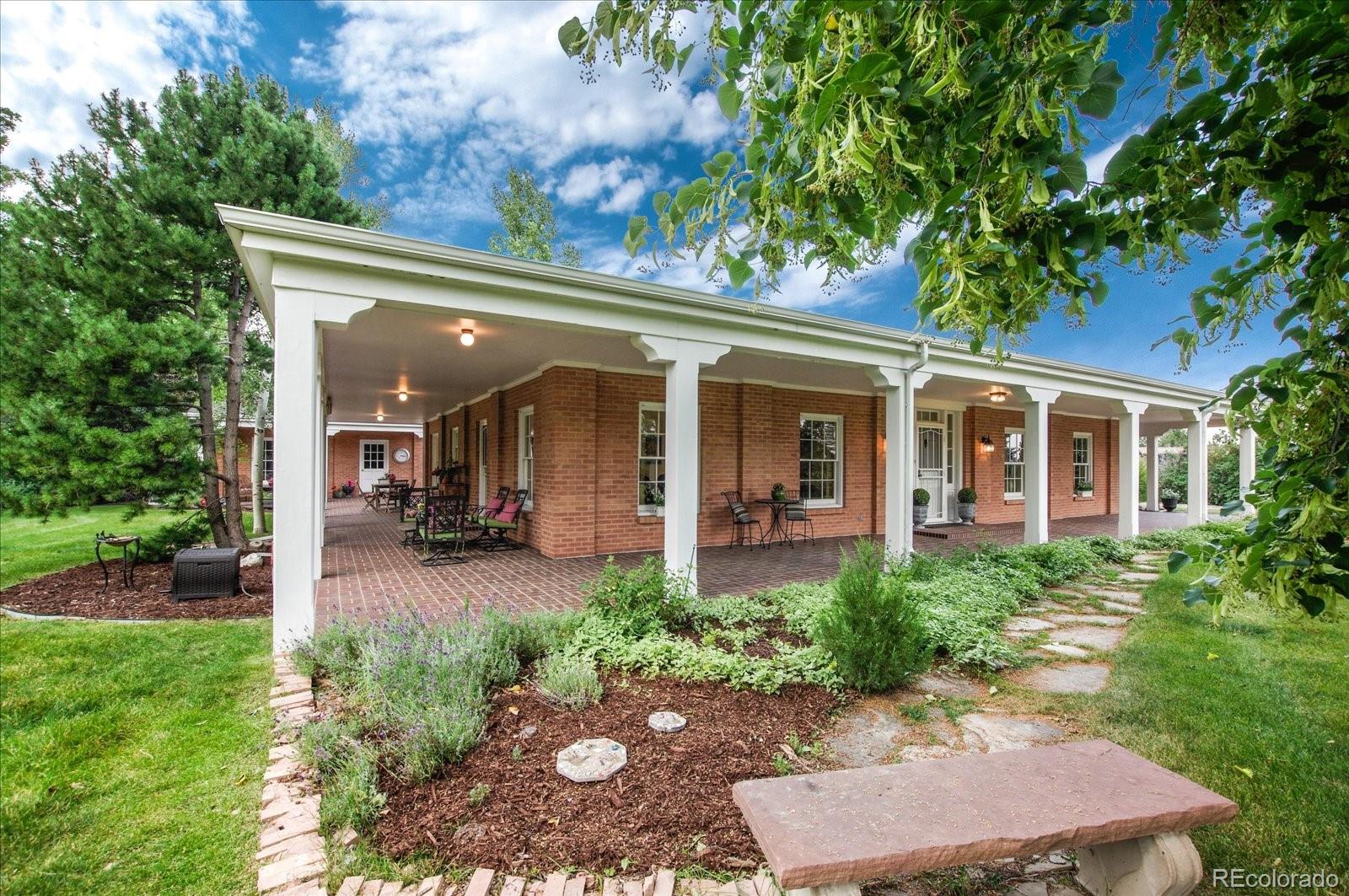 5225 Ridge Trail Bow Mar, CO 80123 - Photo 12 of 40 front view of a house with a porch
