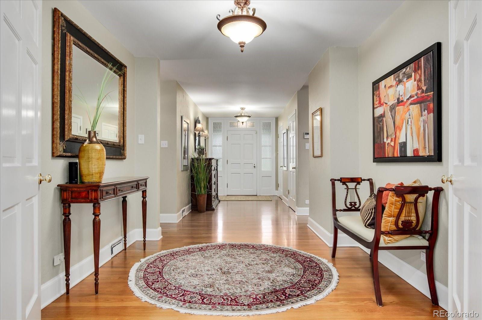 5225 Ridge Trail Bow Mar, CO 80123 - Photo 16 of 40 a view of a hallway with furniture and a rug