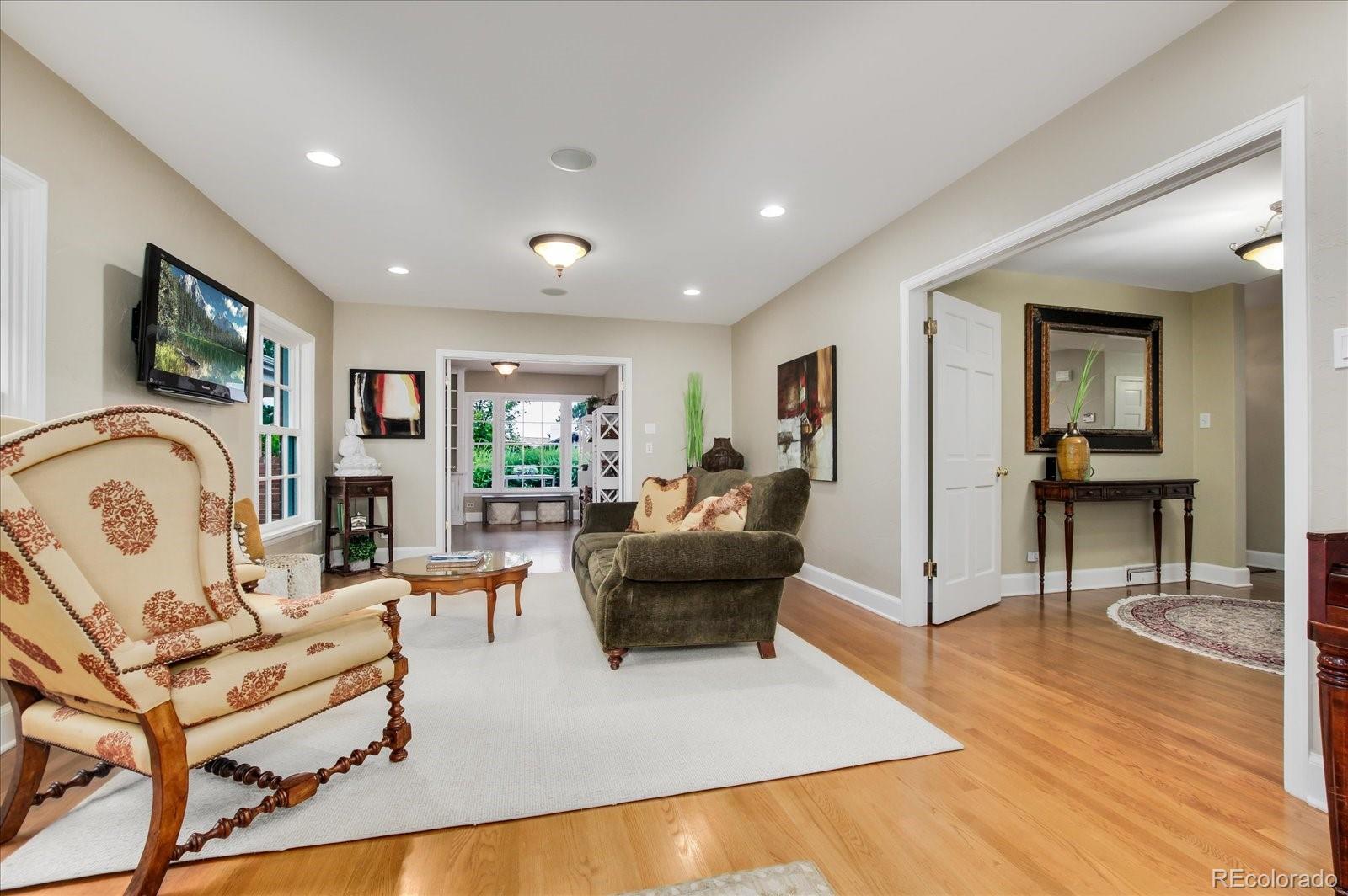 5225 Ridge Trail Bow Mar, CO 80123 - Photo 17 of 40 a living room with furniture and a flat screen tv
