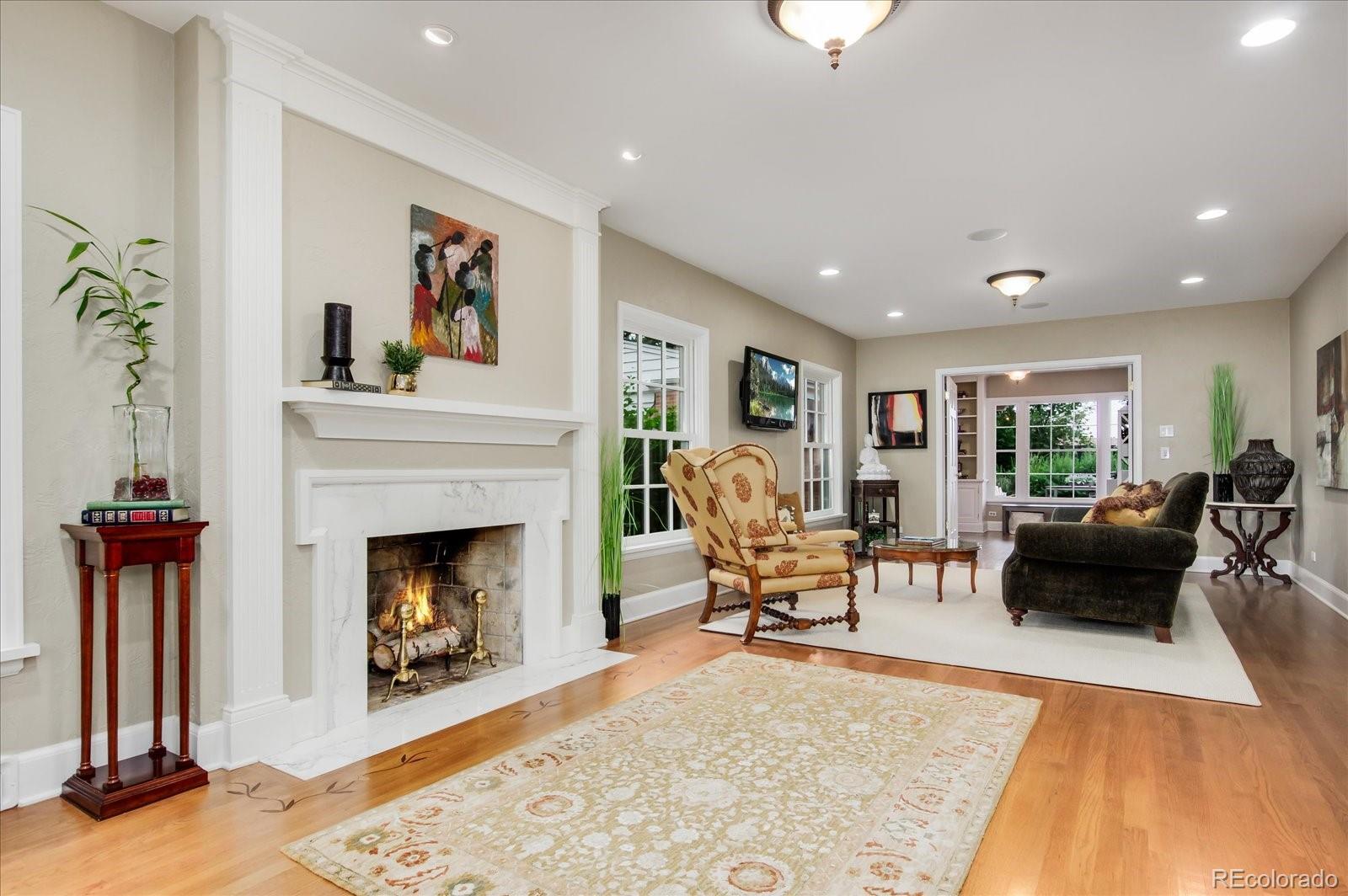 5225 Ridge Trail Bow Mar, CO 80123 - Photo 18 of 40 a living room with furniture and a fireplace