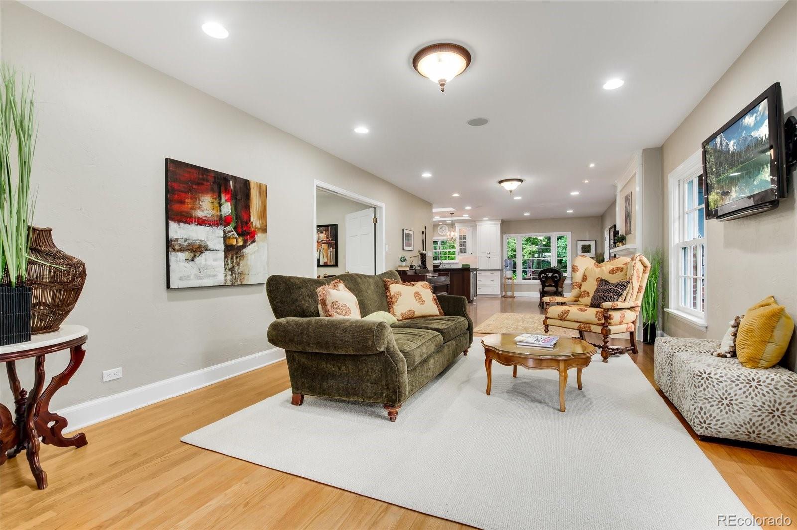5225 Ridge Trail Bow Mar, CO 80123 - Photo 20 of 40 a living room with furniture and a flat screen tv