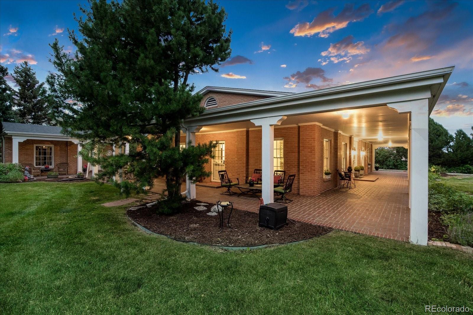 5225 Ridge Trail Bow Mar, CO 80123 - Photo 2 of 40 a view of a porch with chairs and backyard