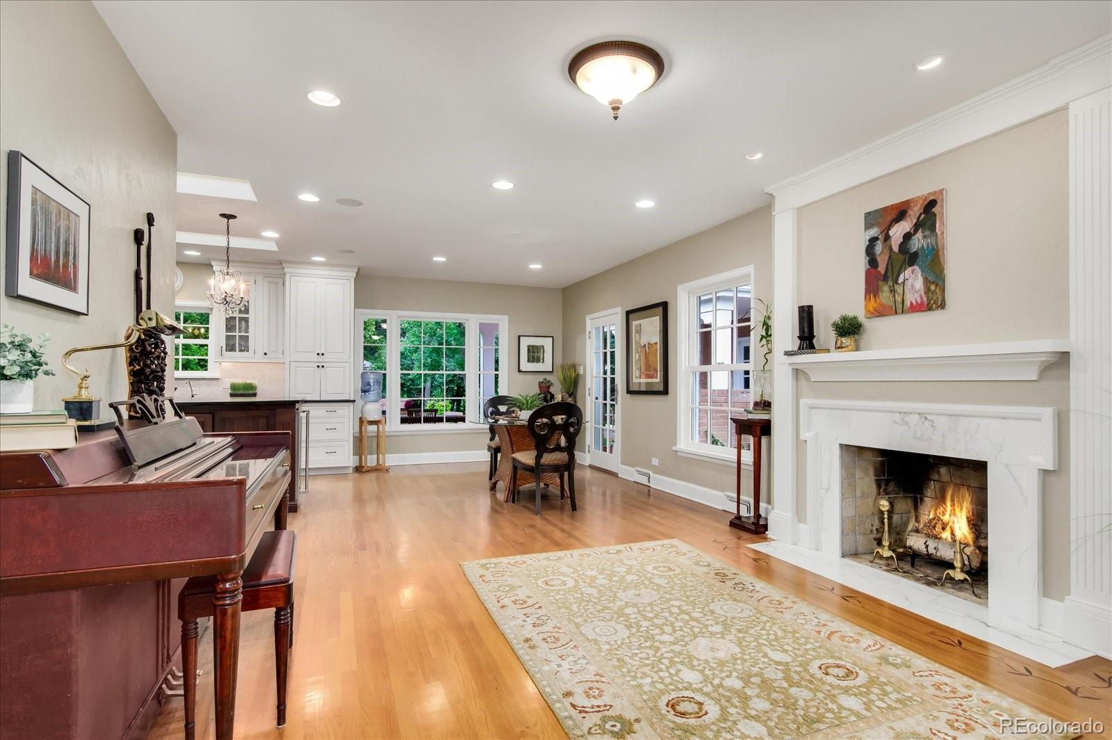 5225 Ridge Trail Bow Mar, CO 80123 - Photo 21 of 40 a living room with furniture and a fireplace