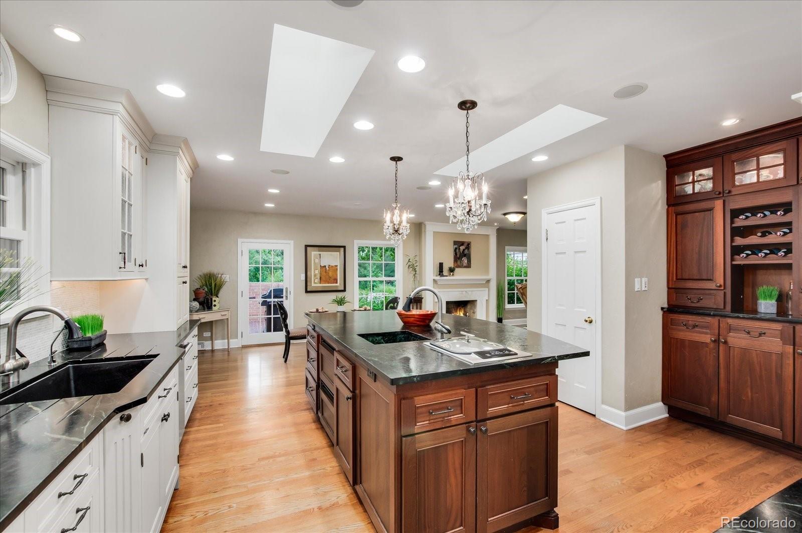 5225 Ridge Trail Bow Mar, CO 80123 - Photo 25 of 40 a large kitchen with granite countertop lots of counter top space