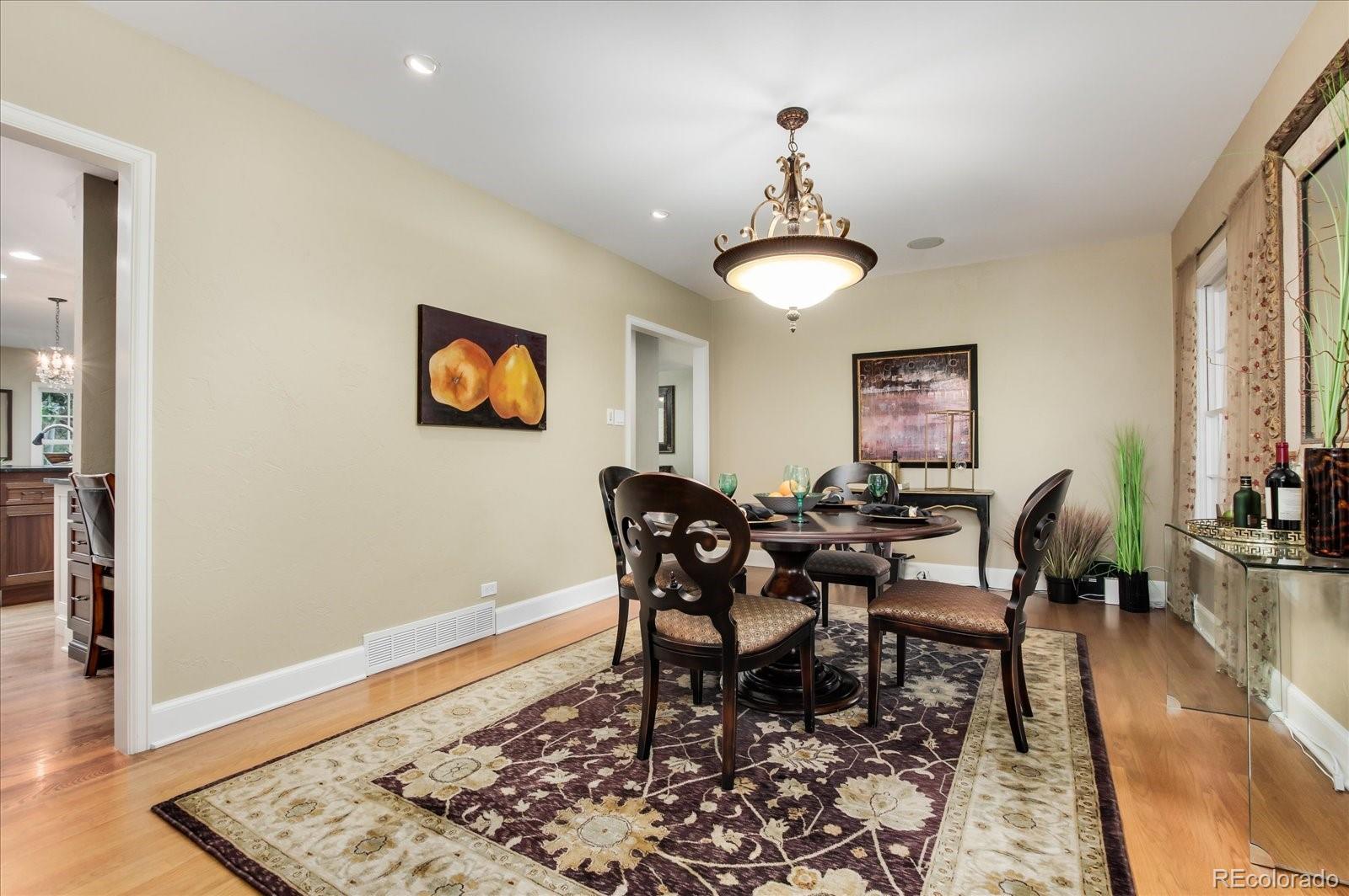 5225 Ridge Trail Bow Mar, CO 80123 - Photo 30 of 40 a view of a dining room with furniture and wooden floor