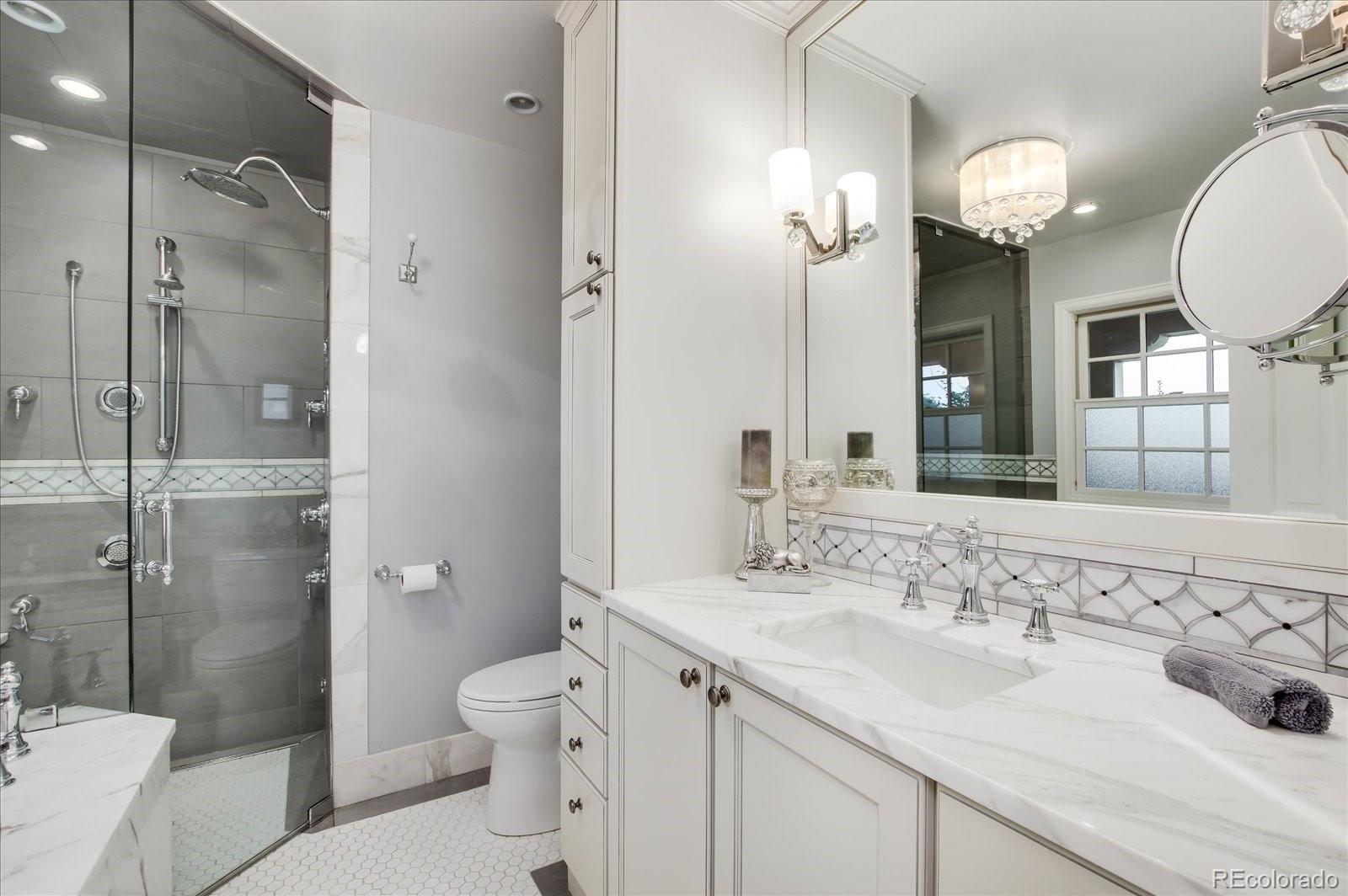 5225 Ridge Trail Bow Mar, CO 80123 - Photo 32 of 40 a bathroom with a sink double vanity and a mirror