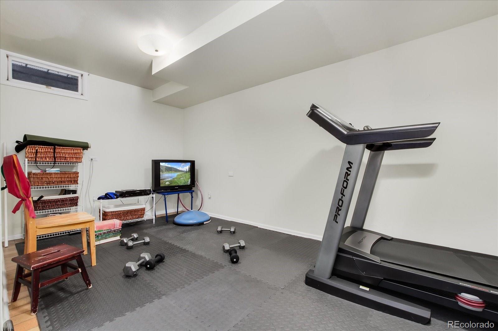 5225 Ridge Trail Bow Mar, CO 80123 - Photo 40 of 40 a view of a room with gym equipment