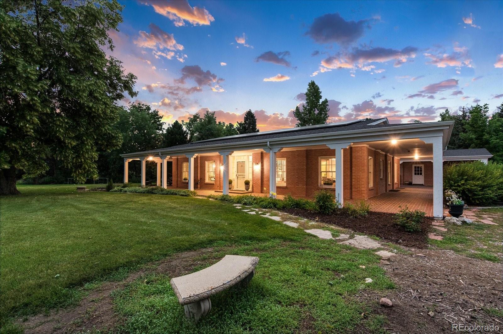 5225 Ridge Trail Bow Mar, CO 80123 - Photo 7 of 40 a view of a house with a backyard