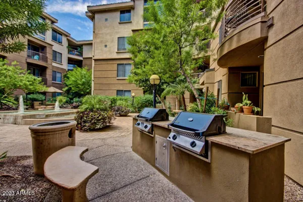 a view of a patio with chairs and tables