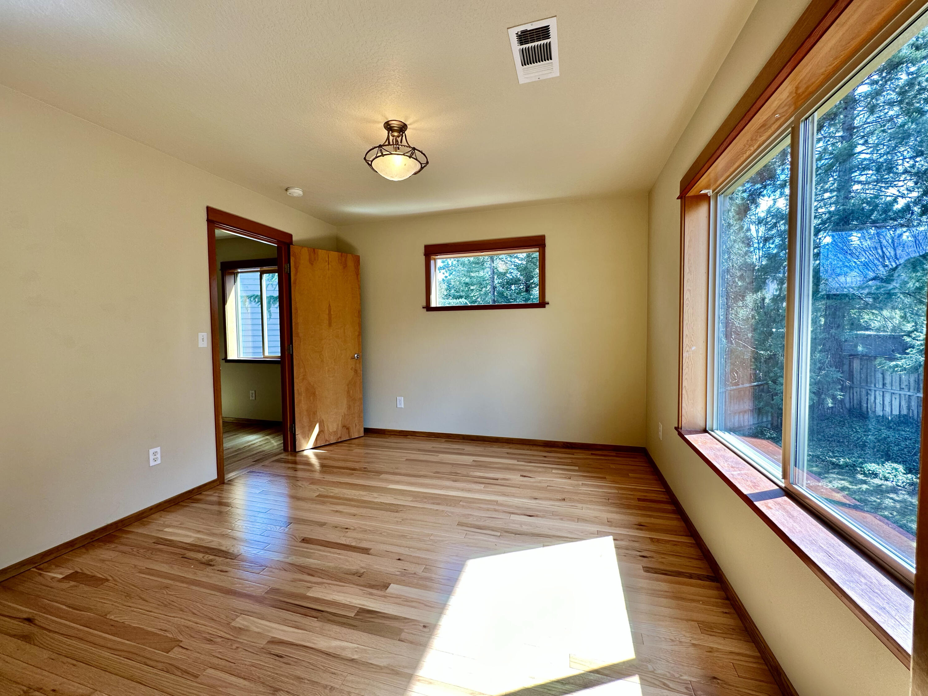 133 Max Loop Talent, OR 97540 - Photo 38 of 55 a view of an empty room with wooden floor and a window