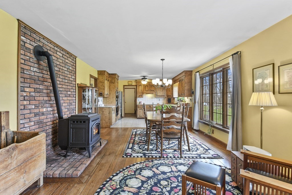 1007 Spring Hill Road Barre, MA 01005 - Photo 13 of 39 a living room with furniture fireplace and large windows