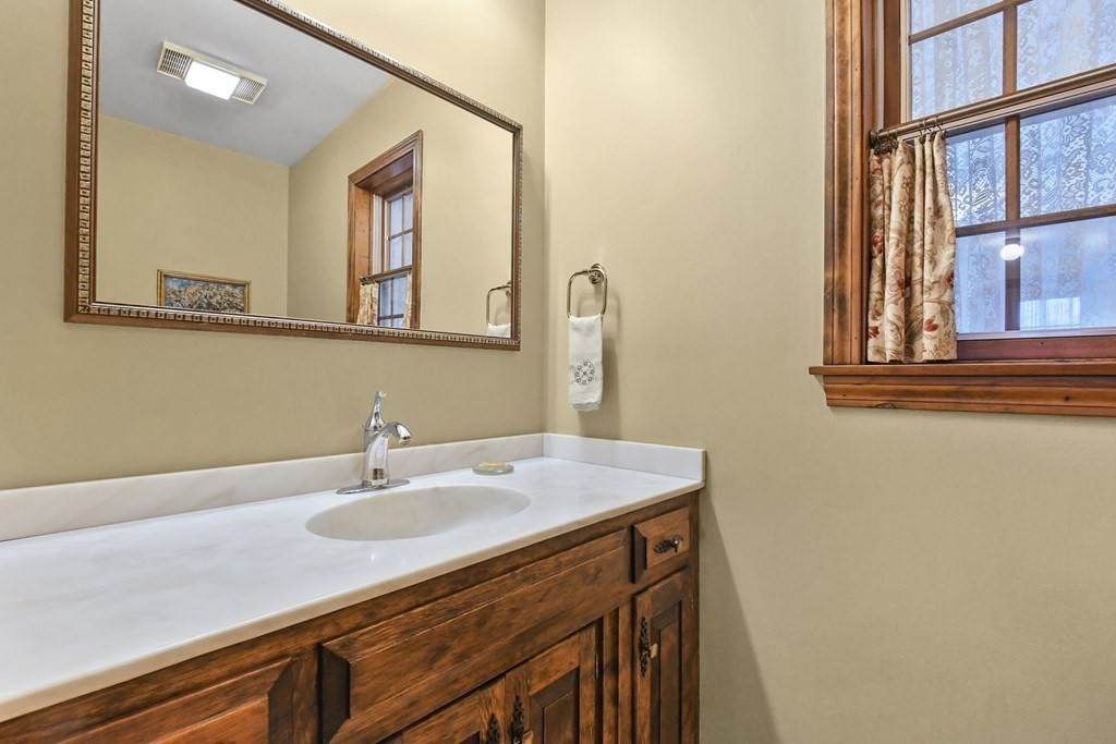 1007 Spring Hill Road Barre, MA 01005 - Photo 20 of 39 a bathroom with a sink and a mirror