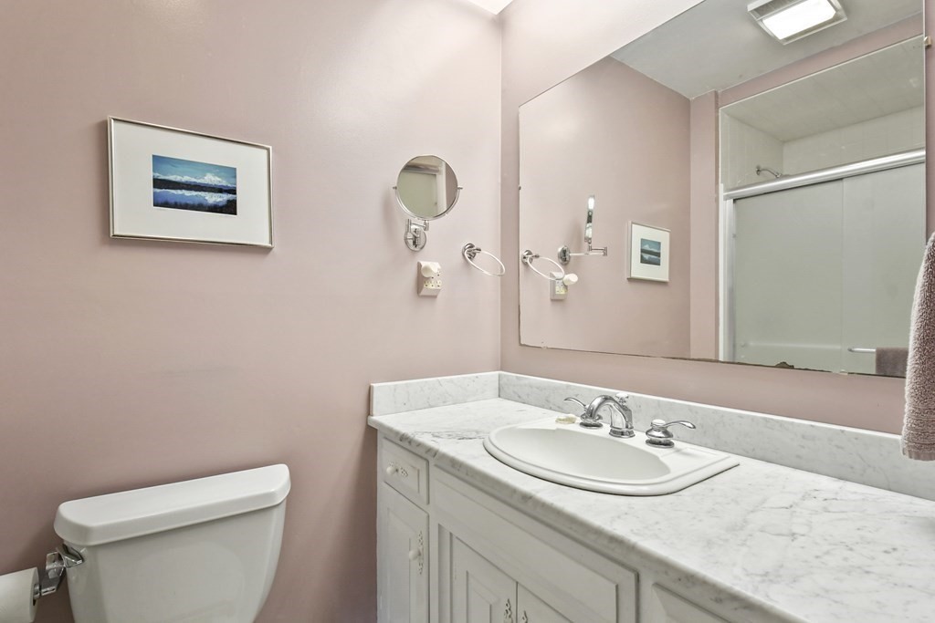 1007 Spring Hill Road Barre, MA 01005 - Photo 23 of 39 a bathroom with a granite countertop sink a toilet and a mirror