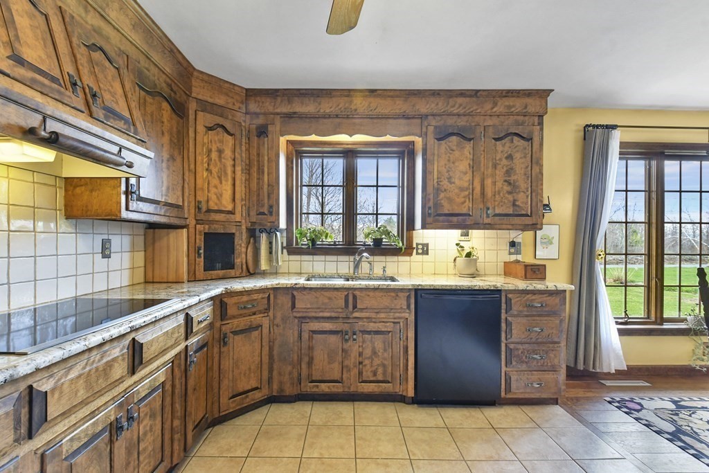 1007 Spring Hill Road Barre, MA 01005 - Photo 9 of 39 a large kitchen with a sink and cabinets