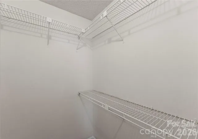 a view of a room with racks on the wall