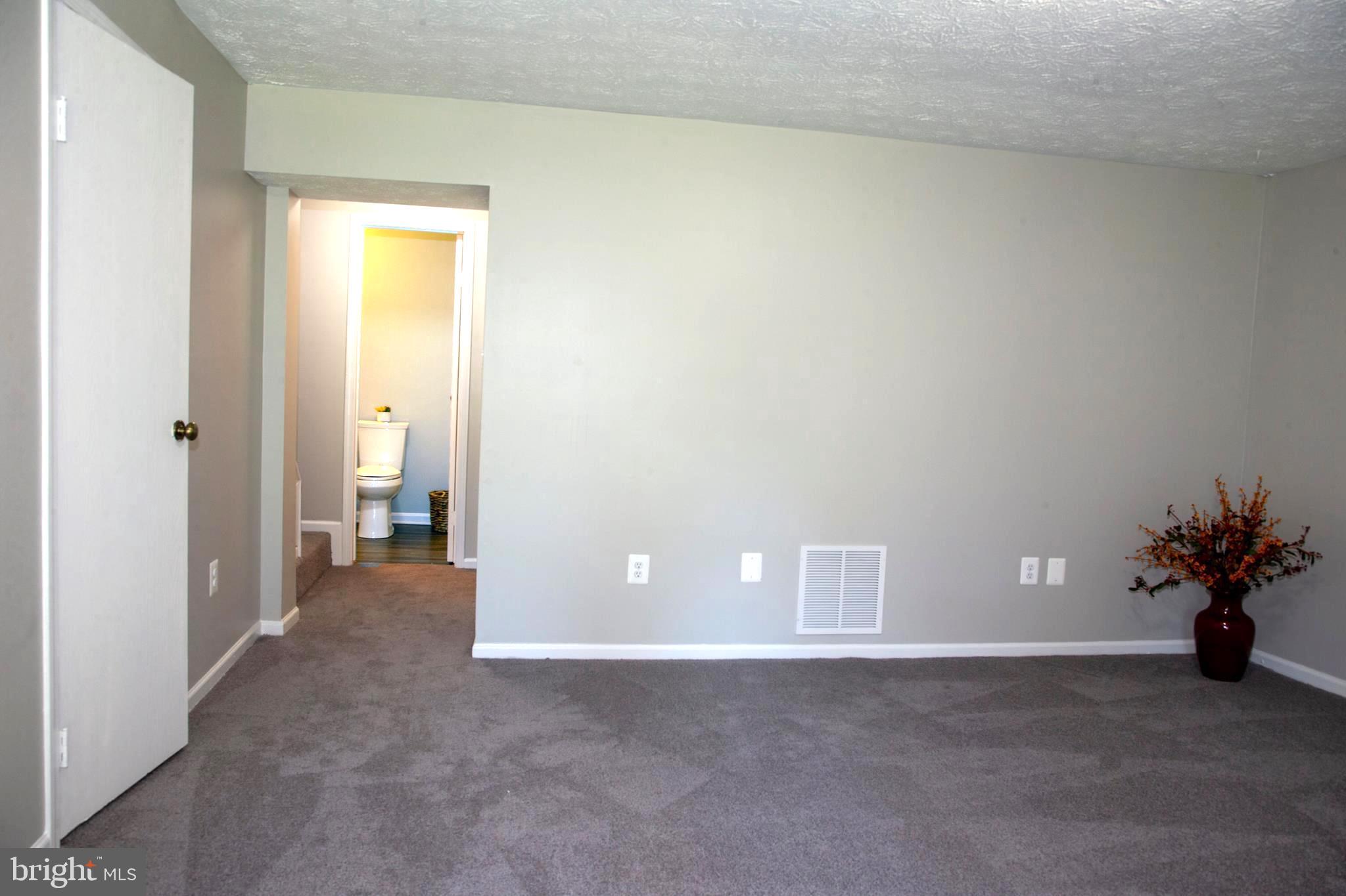 22 Trailwood Road Nottingham, MD 21236 - Photo 21 of 27 Basement w/ Hallway View
