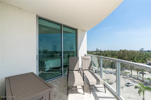 a view of balcony with furniture