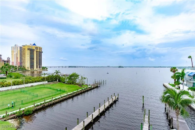 a view of a terrace with lawn chairs