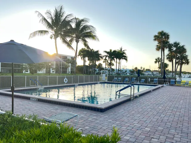 a view of a chair and tables front of the house