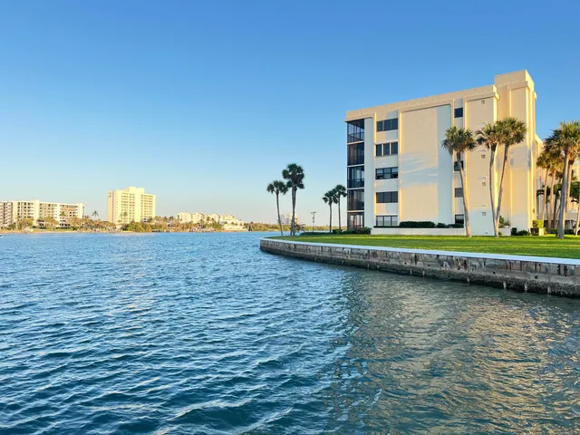 a front view of a building with lake