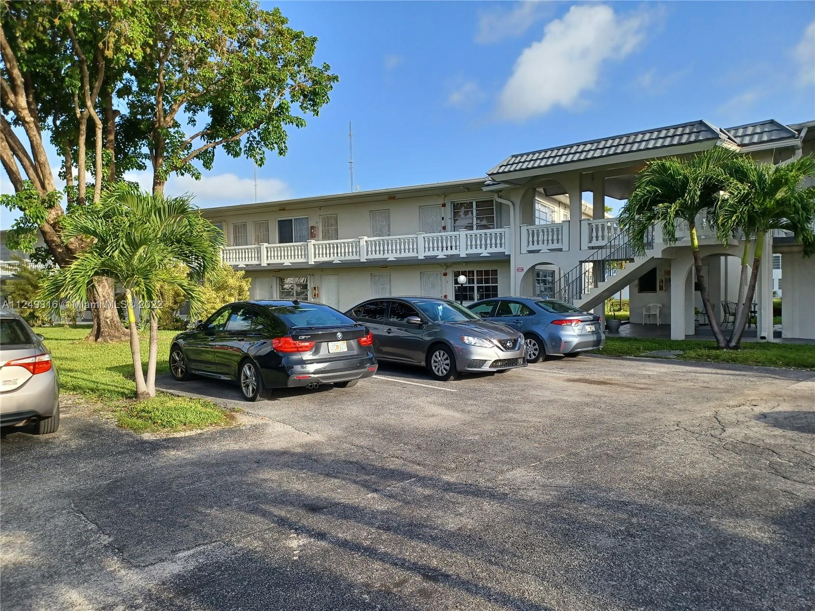 a view of a cars parked in front of a building