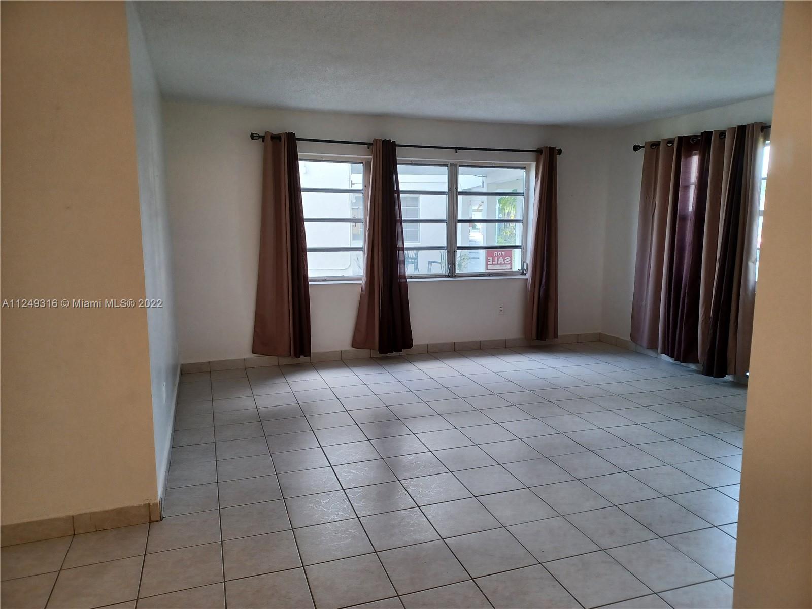Andover Lakes Miami Gardens, FL 33179 - Photo 12 of 41 an empty room with windows