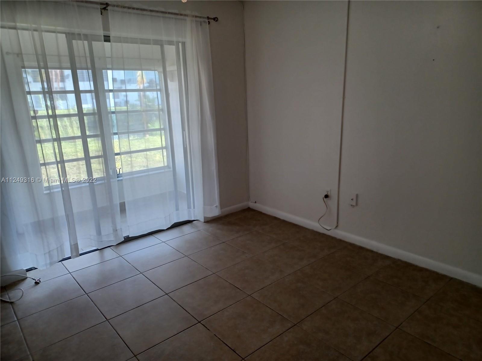 Andover Lakes Miami Gardens, FL 33179 - Photo 29 of 41 a view of an empty room and window