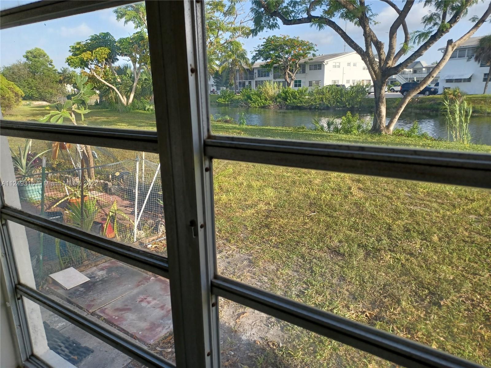 Andover Lakes Miami Gardens, FL 33179 - Photo 7 of 41 a view of a garden from a window