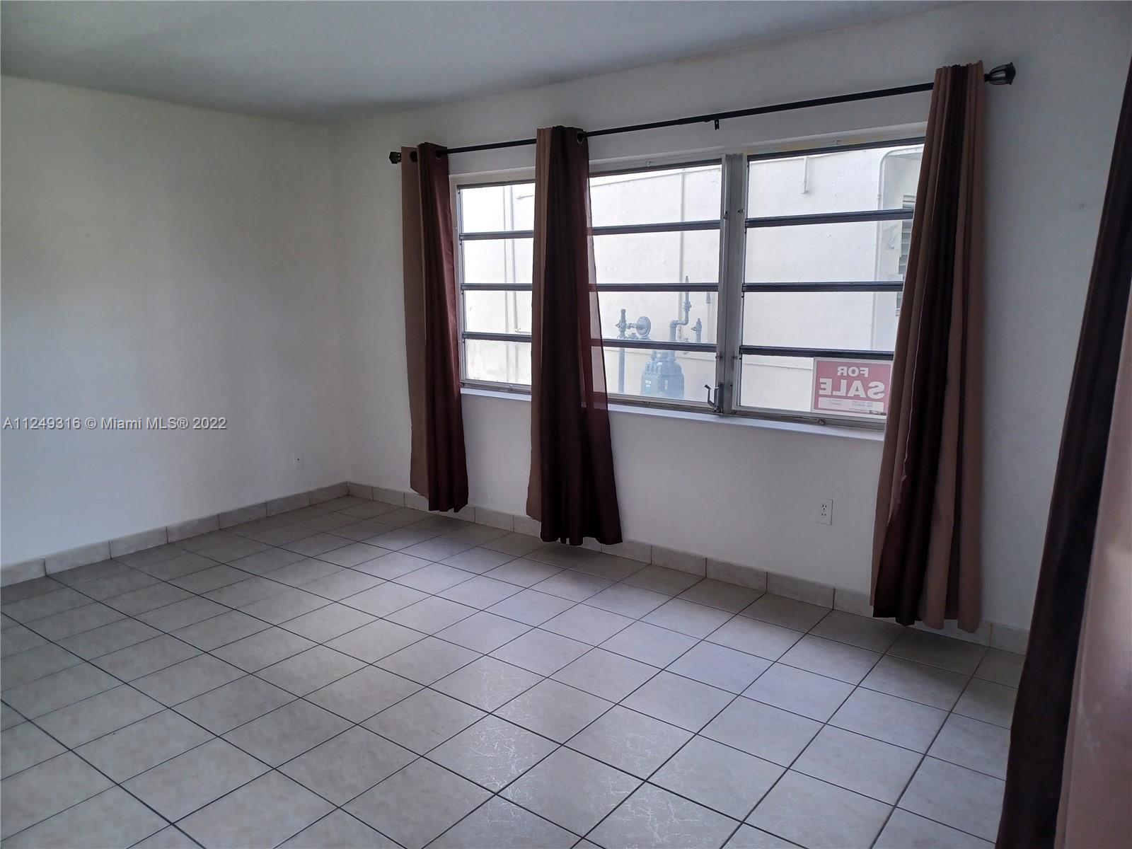 Andover Lakes Miami Gardens, FL 33179 - Photo 10 of 41 an empty room with windows