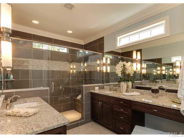 9238 Carlswood Court Raleigh, NC 27613 - Photo 12 of 24 The Special Feature Award Is The Master Bath. Notice The Transom Windows For Natural Light And Privacy. The Counter Space And The Extra Storage Added By Having More Cabinets. The Luxurious Shower With Bench And Dual Showerheads.