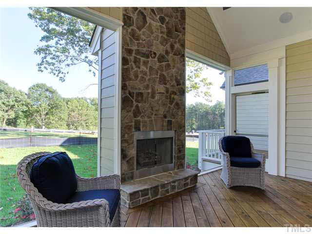 9238 Carlswood Court Raleigh, NC 27613 - Photo 15 of 24 Almost Invisible Screens On This Screened In Porch. Vaulted Ceiling With Ceiling Fan And Prewired Speakers. Remote Control Gas Fireplace. Fully Sodded Yard With Irrigation. Grilling Deck Off The Back Of The Screen Porch.
