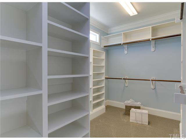 9238 Carlswood Court Raleigh, NC 27613 - Photo 16 of 24 An Organizing Dream. Multiple Heights In The Master Closet For Shoes, Purses, Boots and Clothing. Overhead Storage For Luggage And Out Of Season Items.