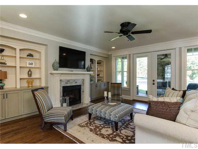 9238 Carlswood Court Raleigh, NC 27613 - Photo 3 of 24 Open Entertaining Flow With View Of Ourdoor Remote Control Fireplace On Screen Porch.