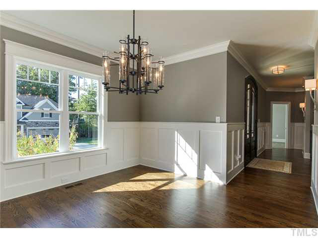 9238 Carlswood Court Raleigh, NC 27613 - Photo 5 of 24 Upgraded Crown And Molding. Beautiful Hardwood Floors. Designer Lighting Package And Sconces.