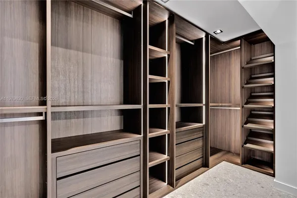 a bedroom with two beds and a large window