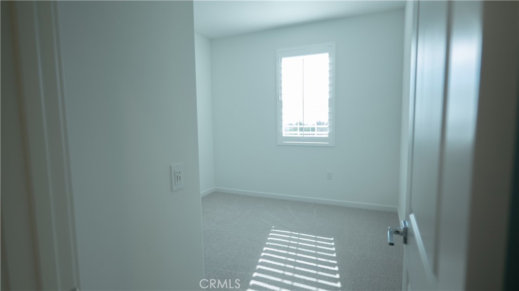 8457 Gabrielino Court Rancho Cucamonga, CA 91730 - Photo 14 of 58 a view of a room that has a window in it