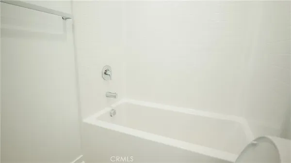 a spacious bathroom with a double vanity sink a mirror and a shower