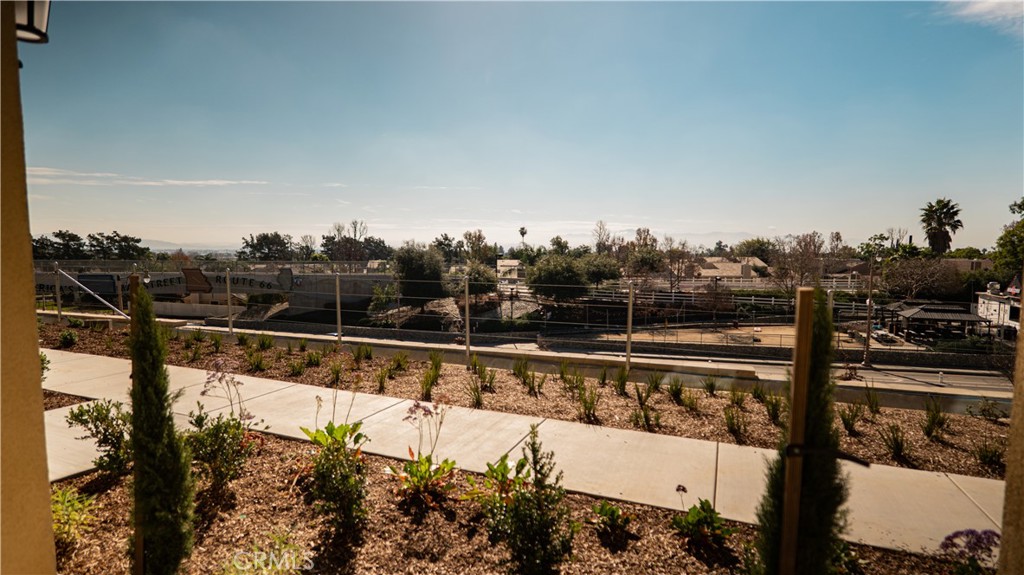 8457 Gabrielino Court Rancho Cucamonga, CA 91730 - Photo 17 of 58 a view of a swimming pool with a yard