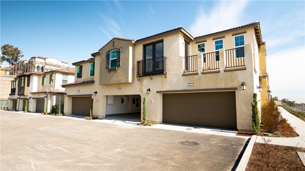 8457 Gabrielino Court Rancho Cucamonga, CA 91730 - Photo 20 of 58 a front view of a house with a yard
