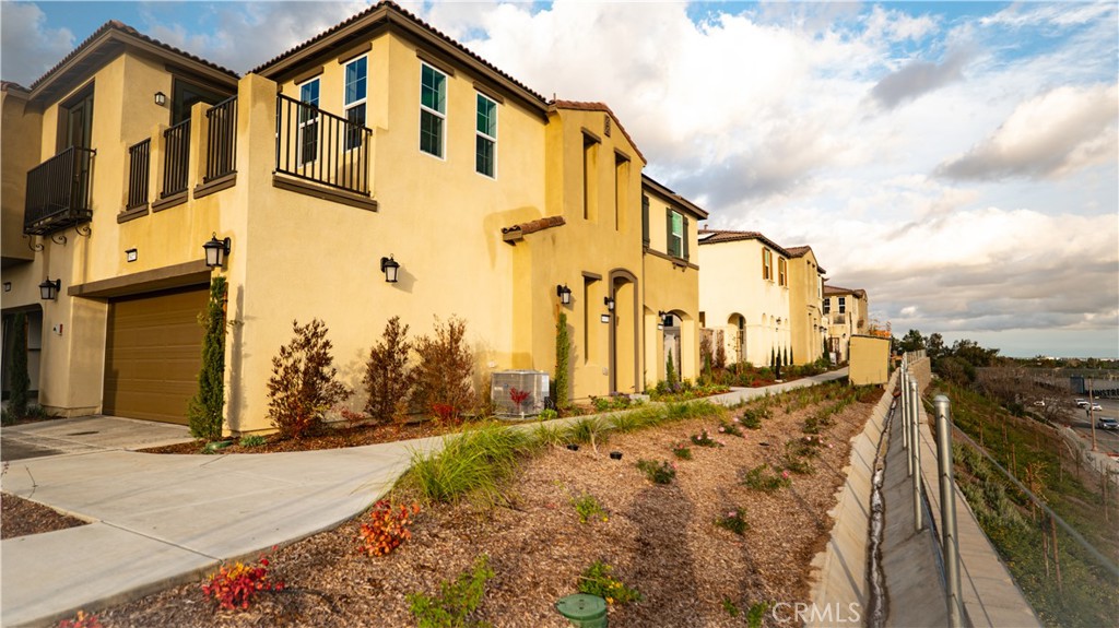 8457 Gabrielino Court Rancho Cucamonga, CA 91730 - Photo 2 of 58 a view of a house with a street
