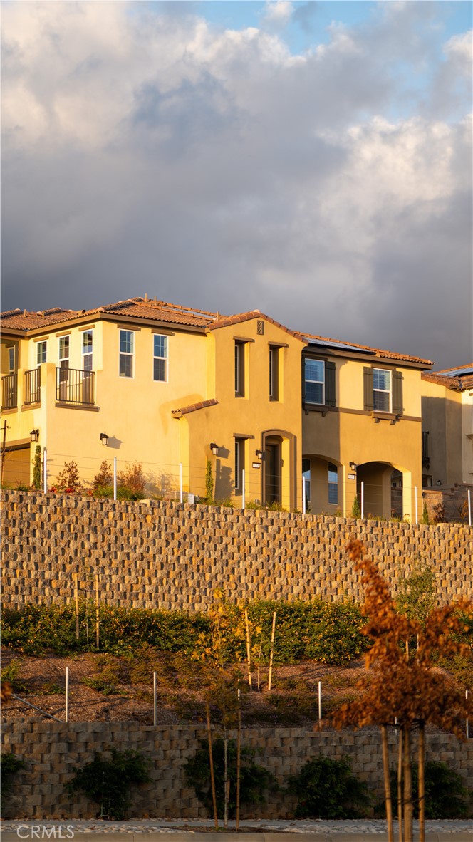 8457 Gabrielino Court Rancho Cucamonga, CA 91730 - Photo 23 of 58 a front view of a multi story residential apartment building