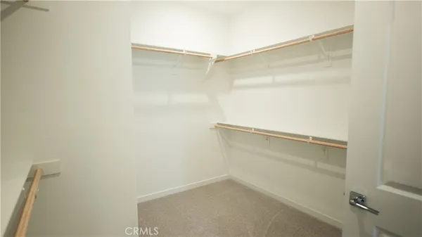 a spacious bathroom with a double vanity sink and mirror