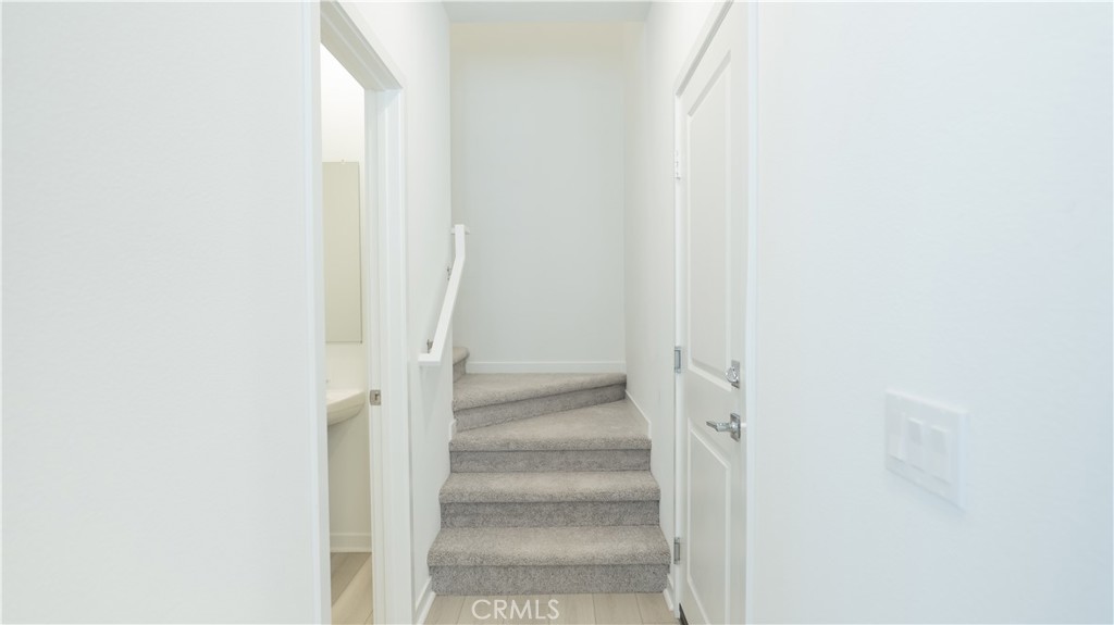 8457 Gabrielino Court Rancho Cucamonga, CA 91730 - Photo 32 of 58 a view of staircase with white walls