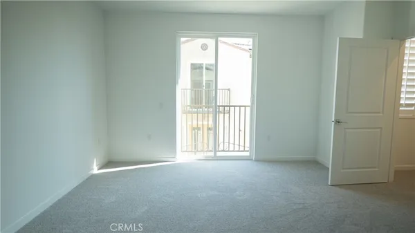 a spacious bathroom with a double vanity sink a mirror and a