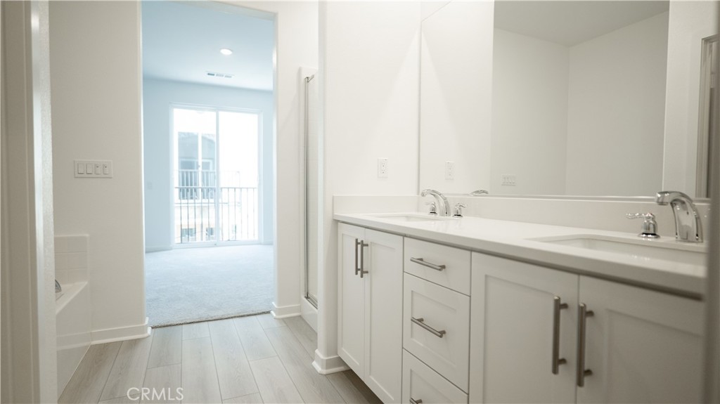 8457 Gabrielino Court Rancho Cucamonga, CA 91730 - Photo 37 of 58 a spacious bathroom with a double vanity sink a mirror and a